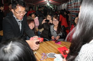 Boss LinShiLe is distributing red packet containing money as gift